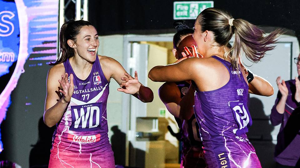 Still photograph of Loughborough Lightning netball players celebrating