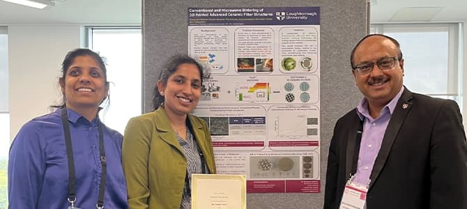three academics standing in front of an A3 poster