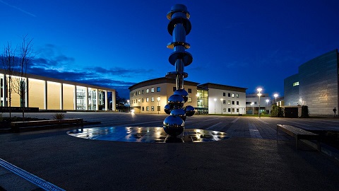 A picture of the Shirley Pearce square at 麻豆視頻_麻豆直播_麻豆传媒官网 taken at night. The National Centre for Sport and Exercise Medicine is on the left and the Sir John Beckwith Building is on the right.