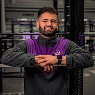 Jess is smiling for a headshot wearing Loughborough Sport kit.