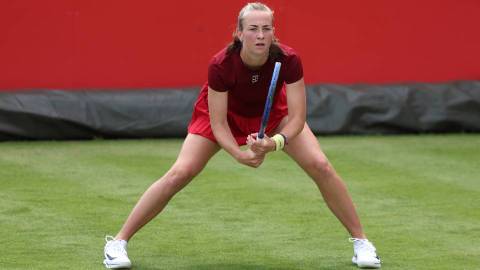mika in tennis action